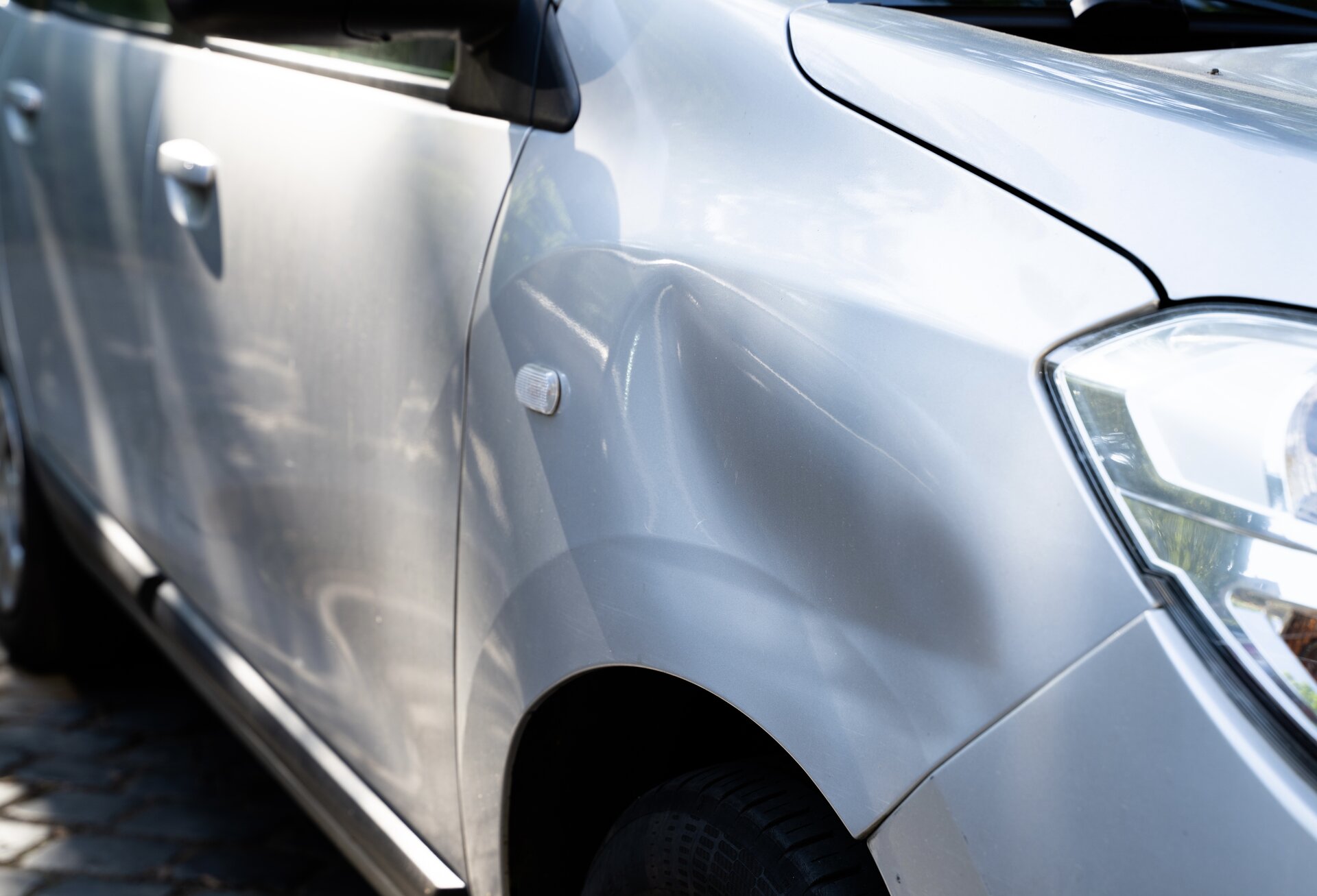 After: hood restored to factory finish by Dentic Denver paintless dent repair